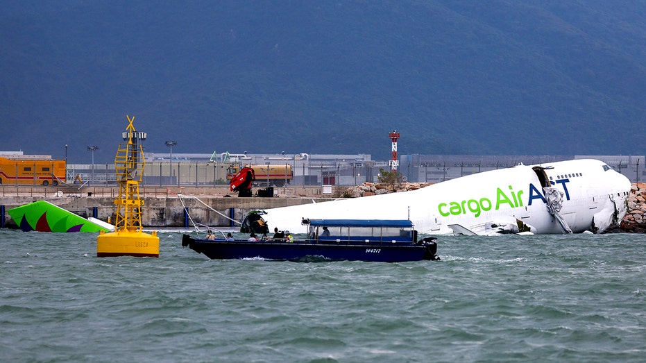 hong-kong-cargo-plane-skids-off-runway,-killing-2