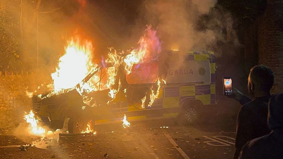 dublin-protesters-clash-with-police,-burn-vehicle-after-migrant-accused-of-sexually-assaulting-irish-girl