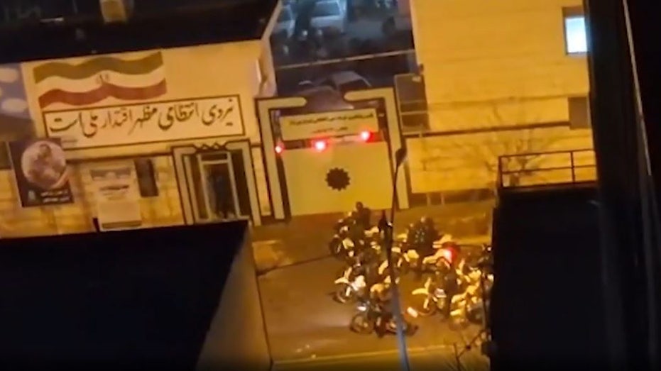 armed-iranian-protesters-battle-police-in-tehran-streets-as-trump-warns-of-forceful-us-response