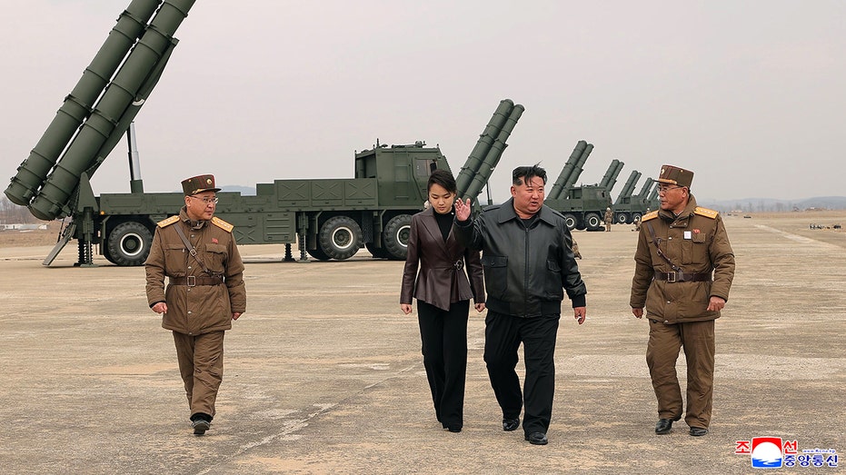 kim-jong-un-appears-with-teenage-daughter-at-live-fire-rocket-test-in-north-korea